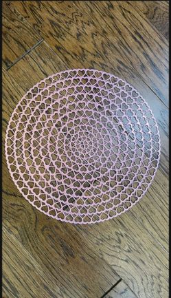 Like new, large 16” diameter, round Metallic Pink  Vinyl Laminated Plastic placemats set of 8 