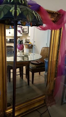 Gorgeous beveled gold 5 ft and 5 inches in H ft mirror and 44 inches in W
