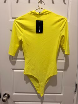 Brand new with tags fluorescent yellow bodysuit never worn