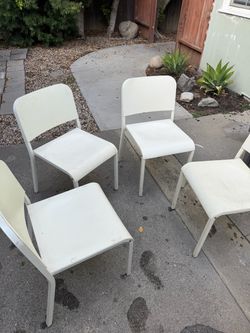 4 Stackable White Chairs