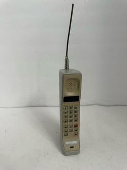 vintage beige Motorola brick phone,
