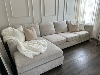 sectional couch + rhinestone vanity mirror + floor lamp