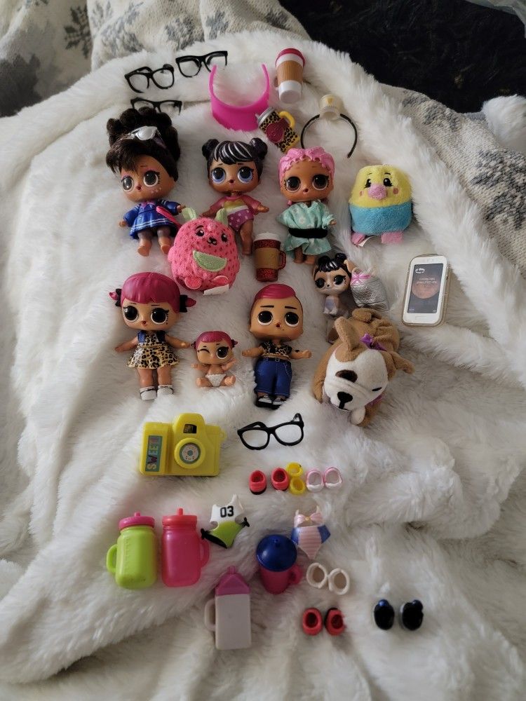 Lol surprise doll lot with miscellaneous pieces.