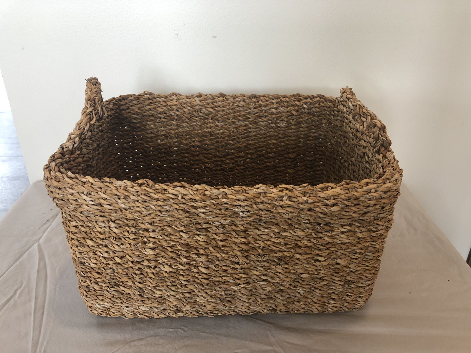 like new woven sea grass basket with handles