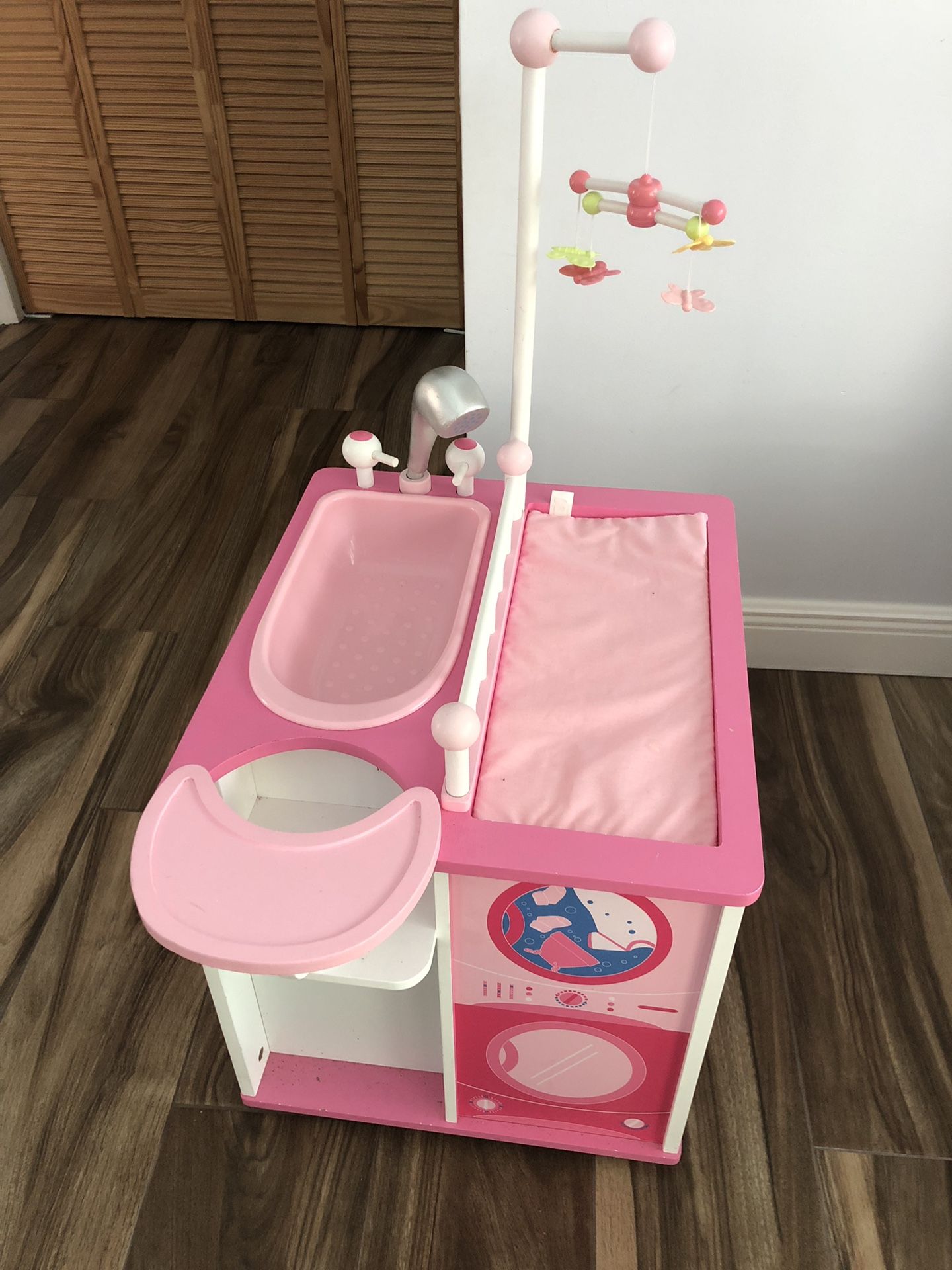 Babydoll changing table, high chair, bath and storage.