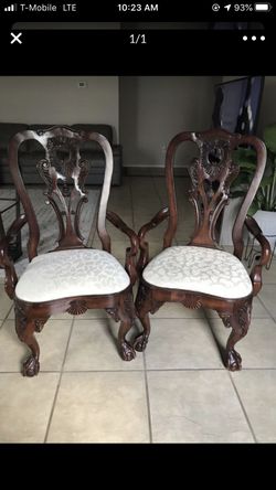 Elegant pair of solid wood hand carved