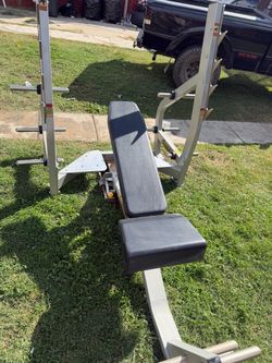 Very nice and strong Olympic weight bench can adjust bench to many positions. Can put weight plates on rack as well. $340