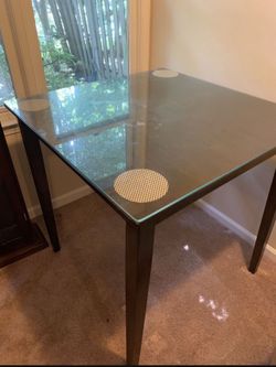 Moving sale dinning table with glass top and 2 chairs