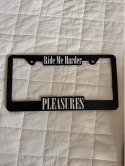 Pleasures license plate frame