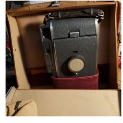 Vintage Polaroid camera and leather case