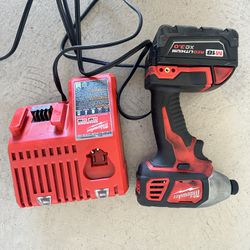 Milwaukee Impact Drill , Battery , And Charger 