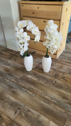 Two white artificial orchids
