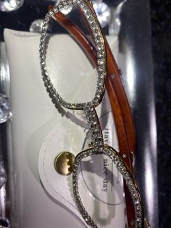 Millionaire Celebrity Glasses “Look Like Money” One (1) Unisex wooden frame with sparkling lab, diamond ice trim. Comes with a white protective case f