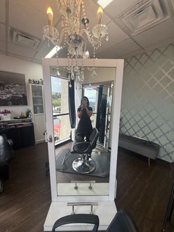 Double sided station with mirrors and storage.