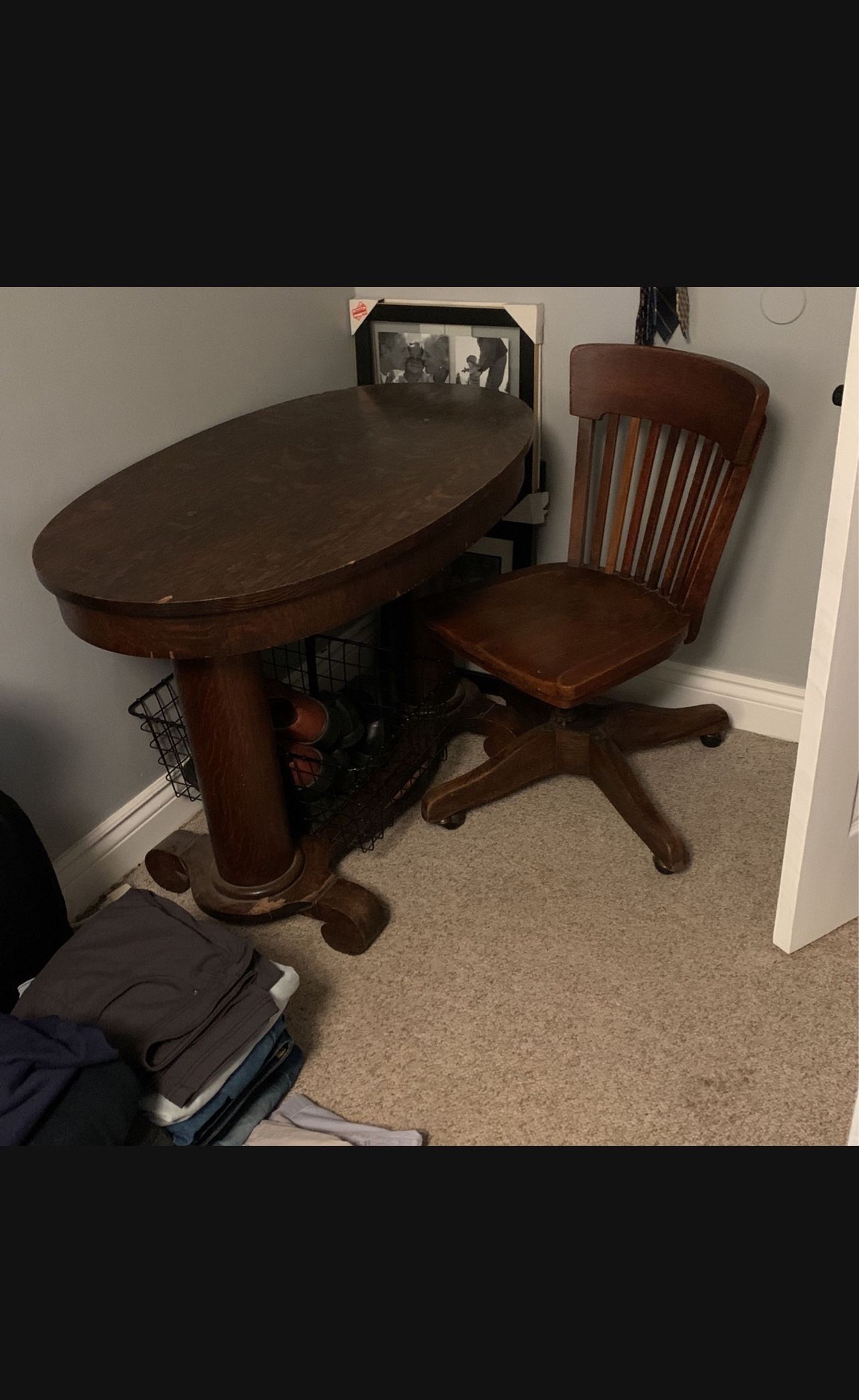 Antique oval table with Marble & Shattuck Chair Company swivel chair
