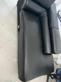 Black faux leather sectional couch