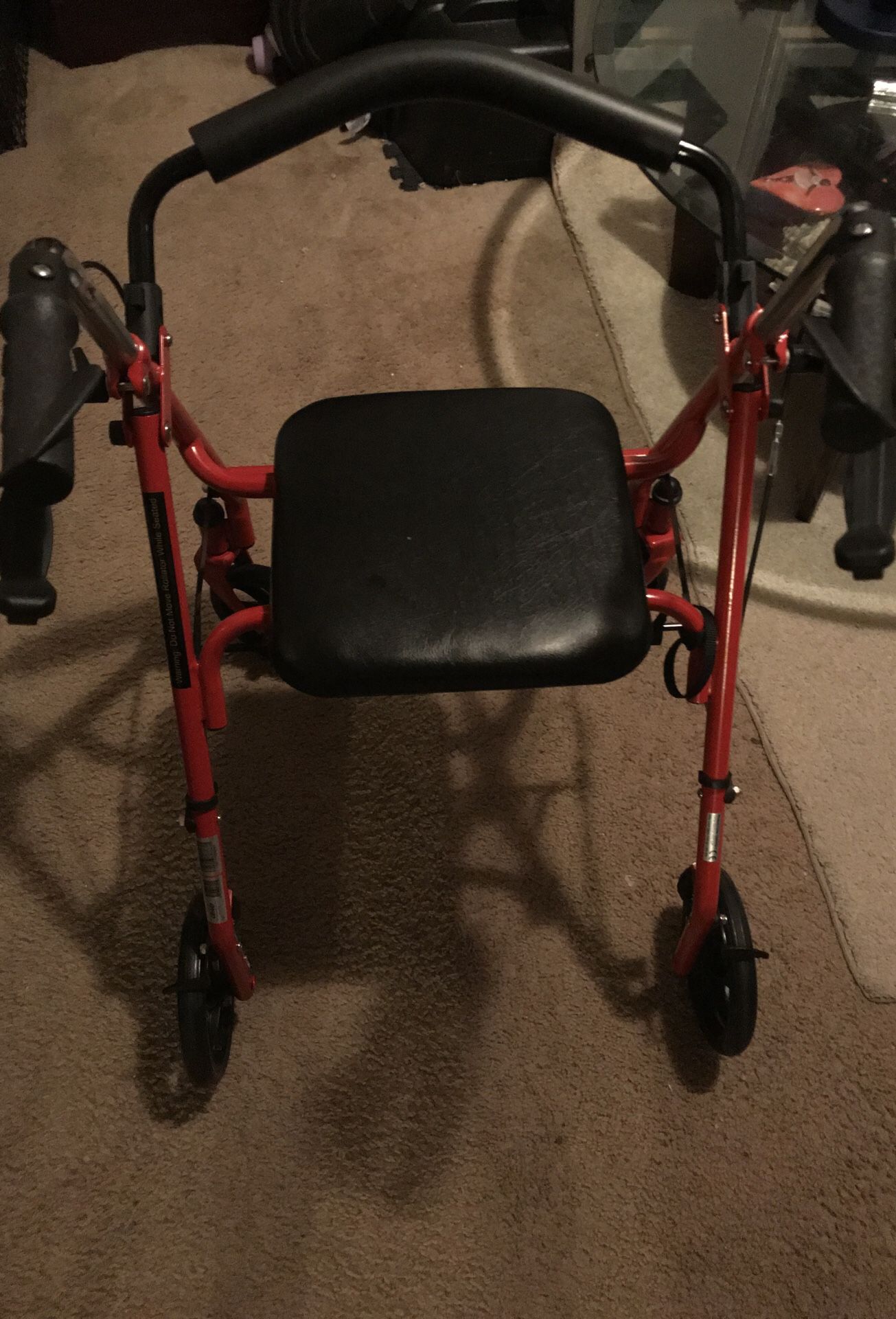 Adult Walker with wheels and hand brakes and comes with seat (New) Folds up for easy storage