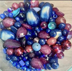 Vibrant mixed beads in shades of deep blue, purple, teal and magenta. Includes faceted, round and oval shapes. Great for jewelry making and embellishm