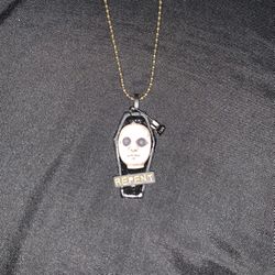 Repent Doll Head Necklace from Chucky