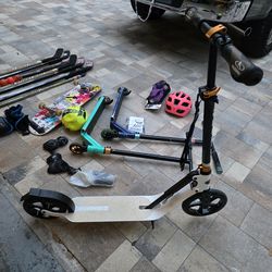 Kids items: scooters, hockey sticks, pads