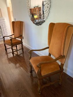 Antique Orange velvet high wing back arm chairs