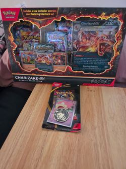 Pokémon TCG: Charizard ex Special Collection box.Pokémon TCG: Mega Evolution – Pitch Black Checklane Blister