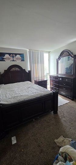 Queen bed with dresser and light stand