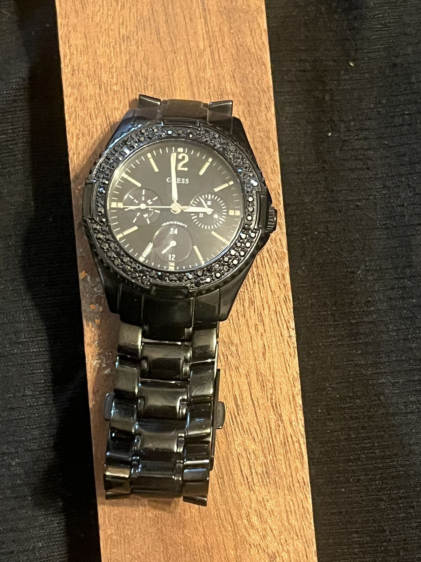 Guess Black Ion-Plated Steel GMT Ladies Watch (U13007L1) for sale! ✨   This elegant timepiece features a black ion-plated stainless steel case and bra