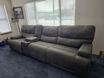 Sectional recliner couch with console
