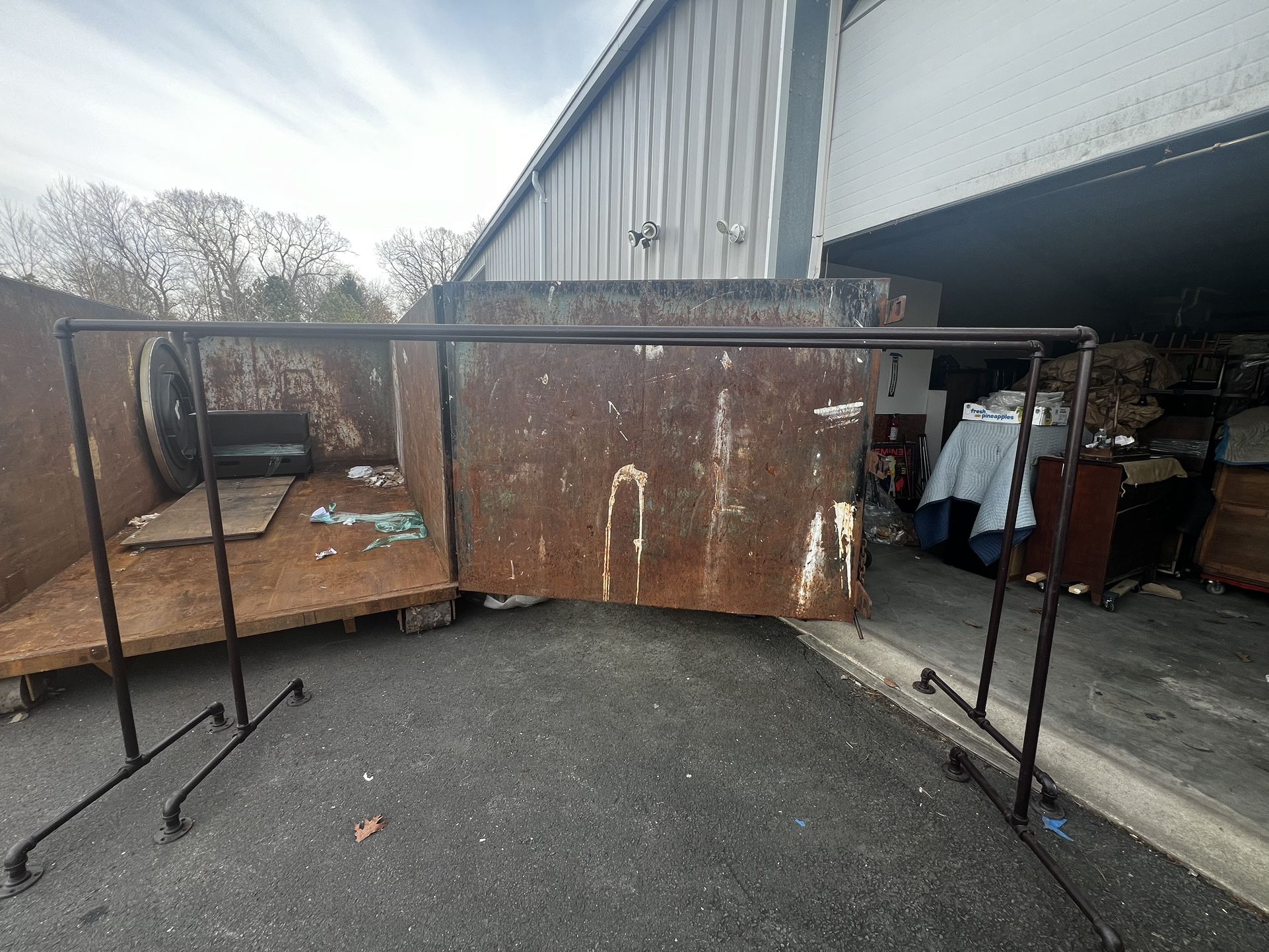 2 Vintage industrial cloth racks 10 ft long