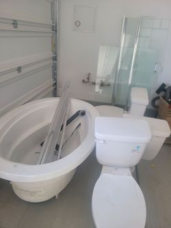 Bathroom tub, shower, 3 toilets