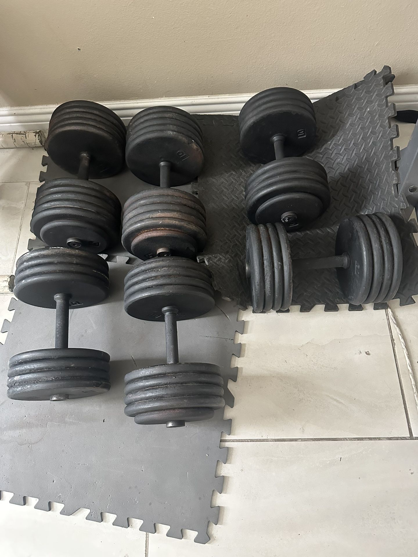 Pairs of 115lbs,95lbs and 85lbs dumbbells weights 590lbs total