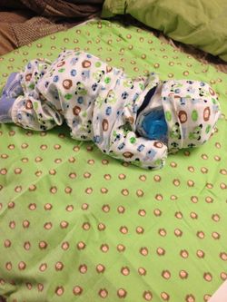 Sleeping baby diaper cake. Many other designs available