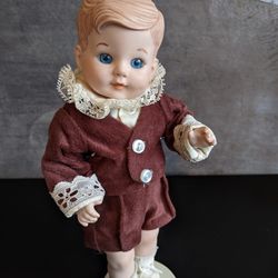 VTG Porcelain Boy W/Blue Eyes in Brown Velvet Short Set Doll w/Stand