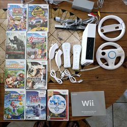 Wii Mario Kart Bundle. 2 Racing Wheels, Console, 2 Controllers,  2 NEW Nunchucks, Mario Galaxy 2 game. 9 Game Lot 