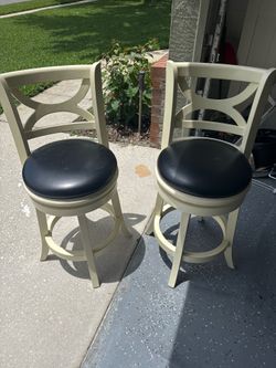 Two swivel counter stools