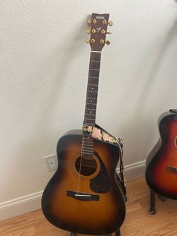 Yamaha guitar with strap