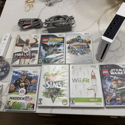 Nintendo Wii Video Game System RVL-001 Console  W/8 Games Cords Lego Skylanders  The Nintendo Wii Video Game System RVL-001 Console Bundle is a classi