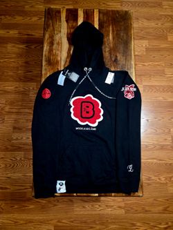 Black Denim by Marshall Fortson, Chicago Streetwear brands Black Pullover Hoodie featuring a bold red floral chenille patch and embroidery. Soft, heav