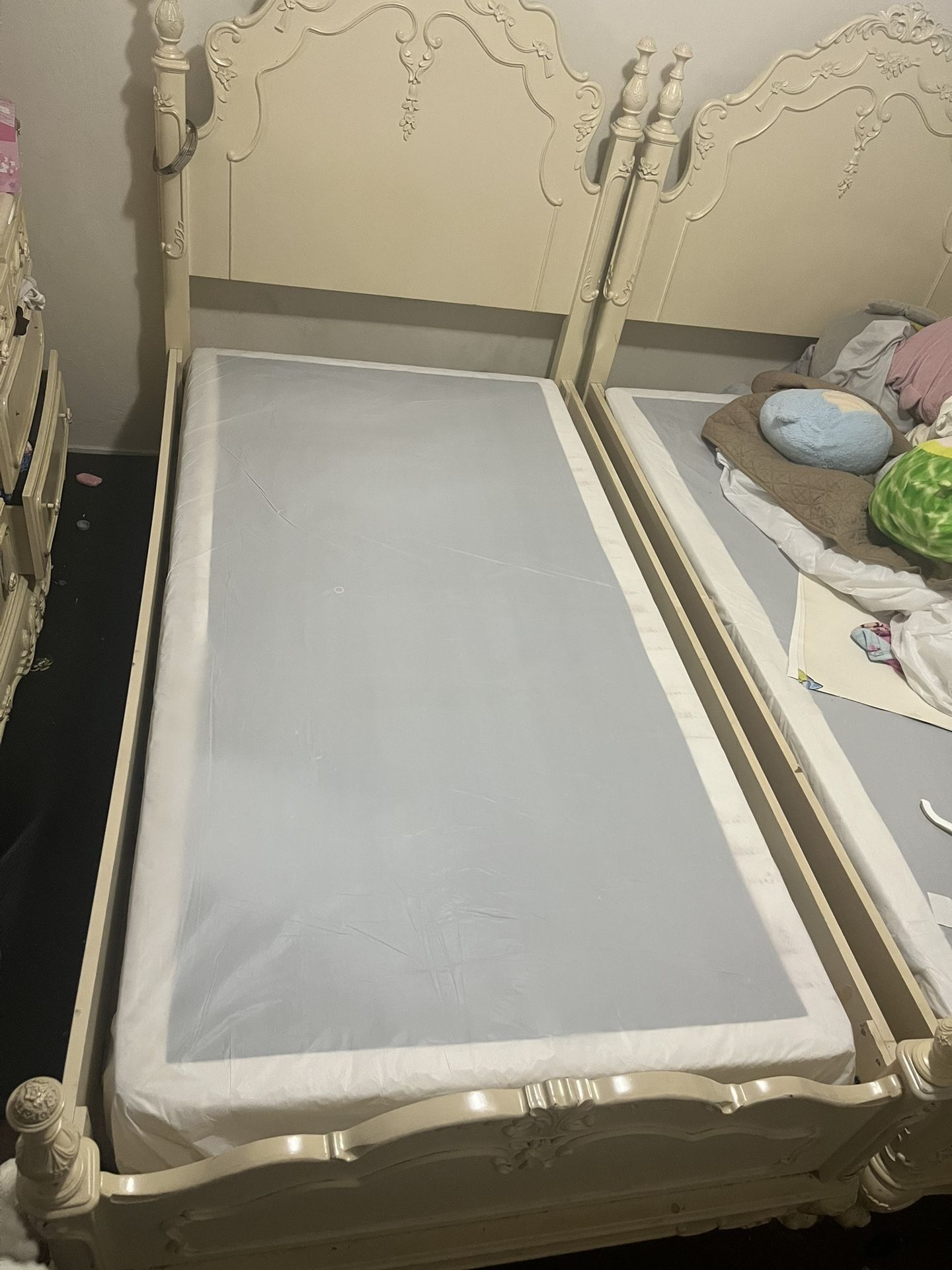 Twin Cream Beds With Ornate Detailing Elegantly Decorated