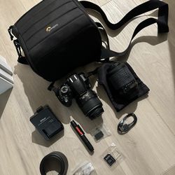 Selling  Nikon D3100 + 55-200mm Lens +benro Tripod