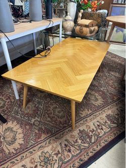 Modern coffee table in a natural oak finish - 55” x 27” x 18”