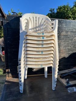 Syroco White Resin Stacking Patio Chairs with a "Deluxe Fan Back" design