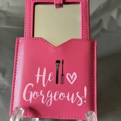 Hello Gorgeous" pink compact pocket mirror with a sleeve