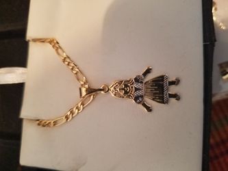 Cadena con dige de niña de oro laminado