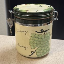 Woodwick Candle In A Sealed Container With Lid.