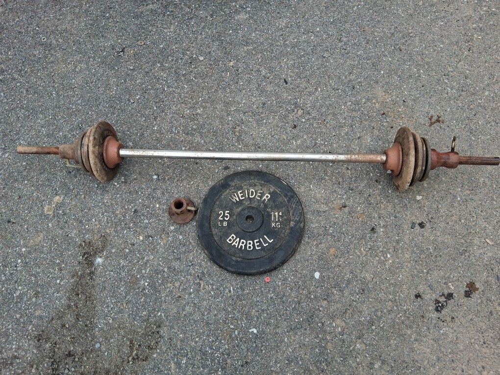 Barbell with different weights: 4 10lb, 4 2lb, 1 25lb