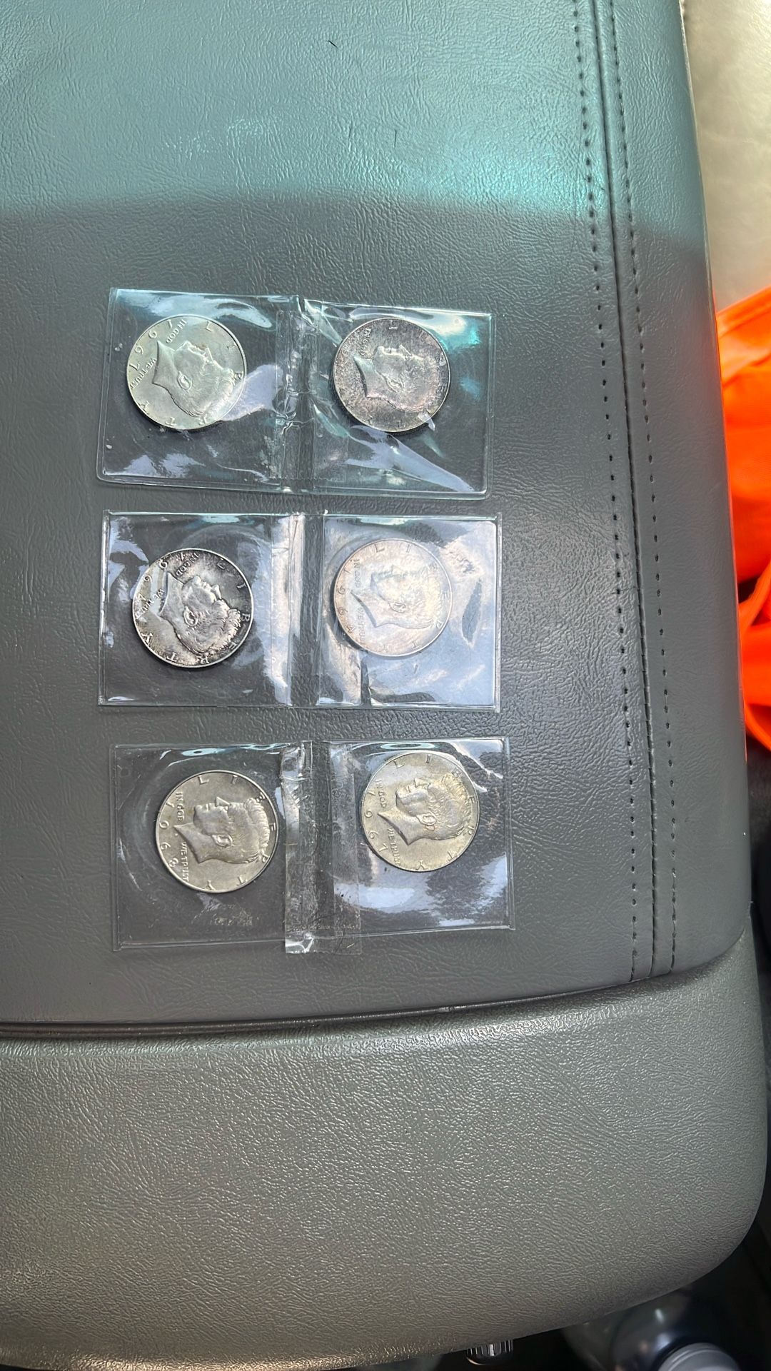 Six Kennedy half dollars three 1964 two 1967 and one 1968