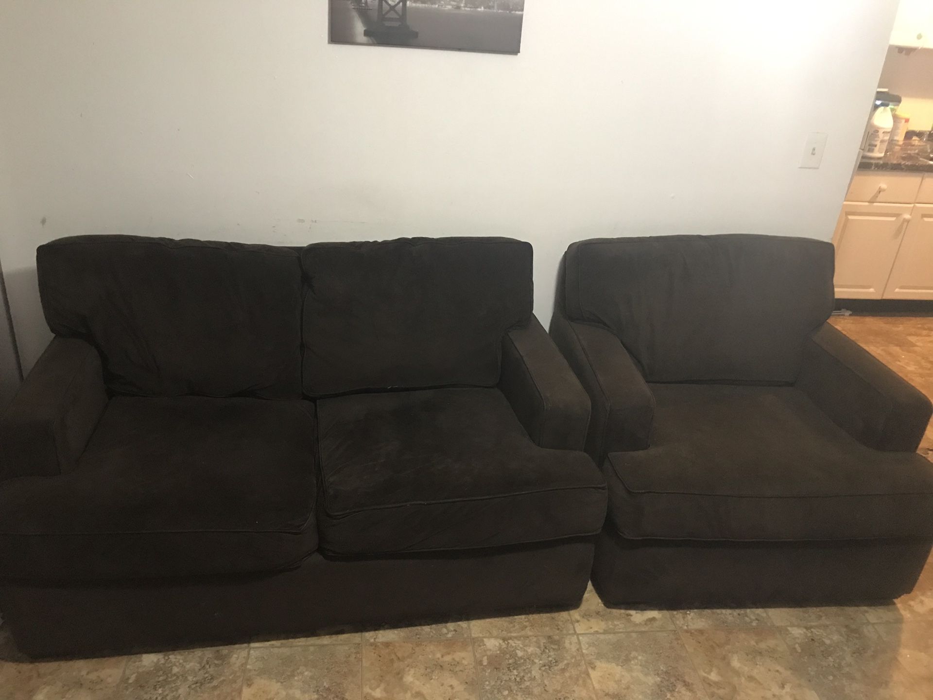 Brown loveseat and chair couch