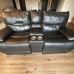 Comfortable two-seater black leather loveseat recliner